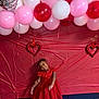 architecture, balloon, building, celebrating, child, clothing, dress, face, female, fun, girl, head, outdoors, party, people, person, photography, portrait, shelter, symbol