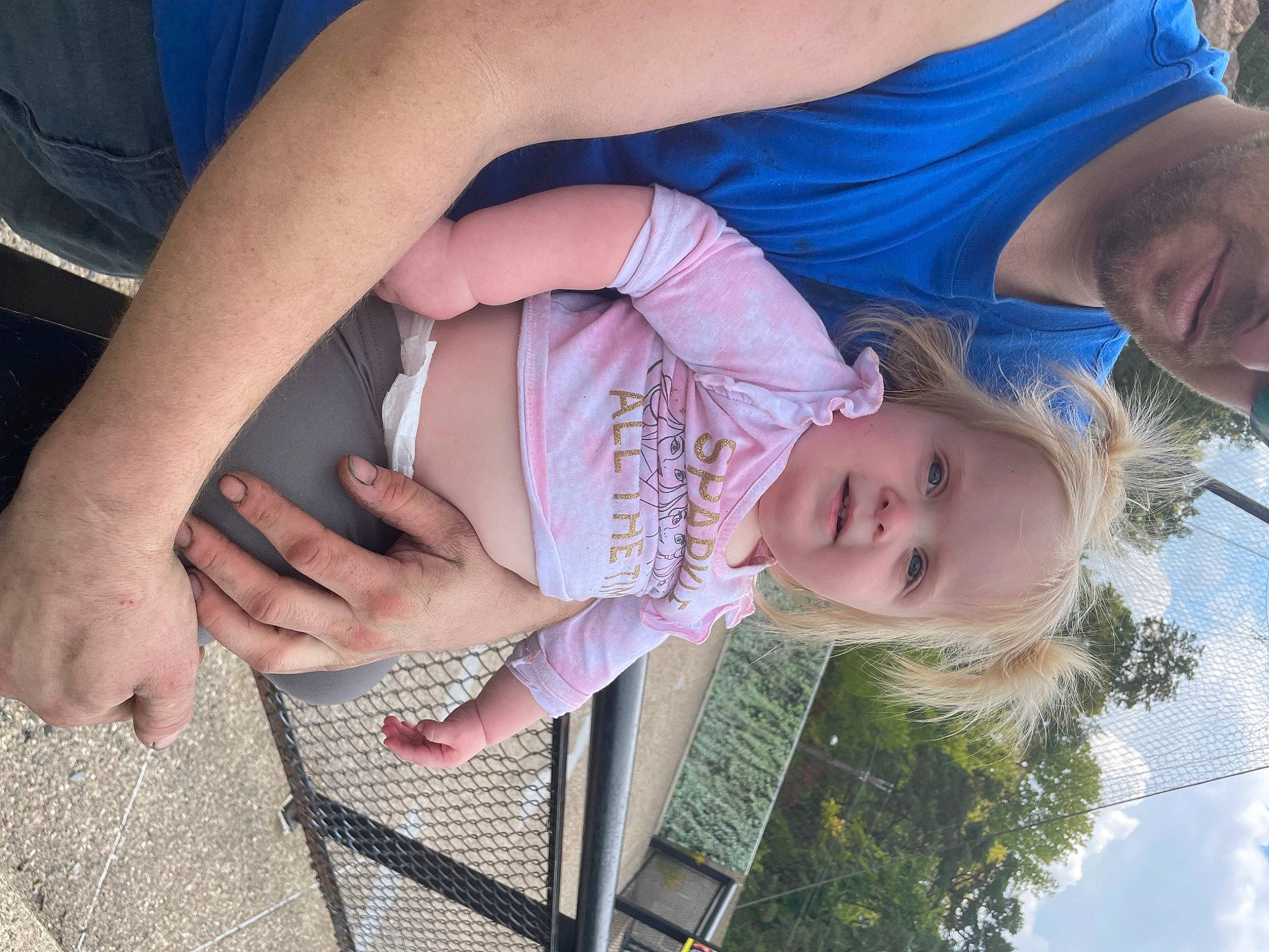 Catherine is registered to the contest to win money with this photo: baby, blue, child, finger, fun, gesture, grass, happy, human_body, leisure, mouth, nail, people_in_nature, person, plant, skin, sky, smile, thumb, toddler