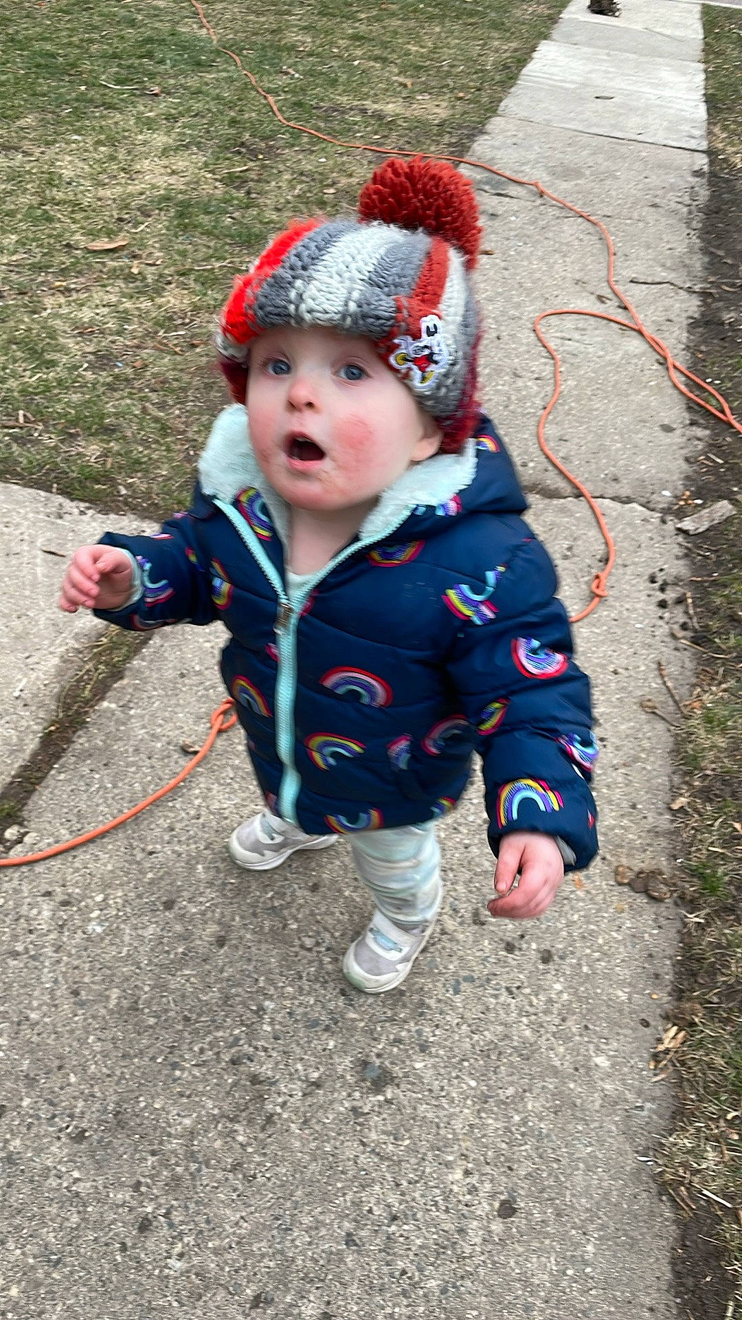 Catherine is registered to the contest to win money with this photo: autumn, baby, baby_toddler_clothing, beanie, cap, child, freezing, fun, grass, headwear, knit_cap, outerwear, pattern, people_in_nature, person, play, recreation, soil, surprise, toddler