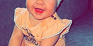 Suttyn is registered to the contest to win money with this photo: accessories, baby, clothing, couch, cushion, face, furniture, happy, hat, head, homedecor, jewelry, necklace, pants, person, photography, pillow, portrait, sitting, smile