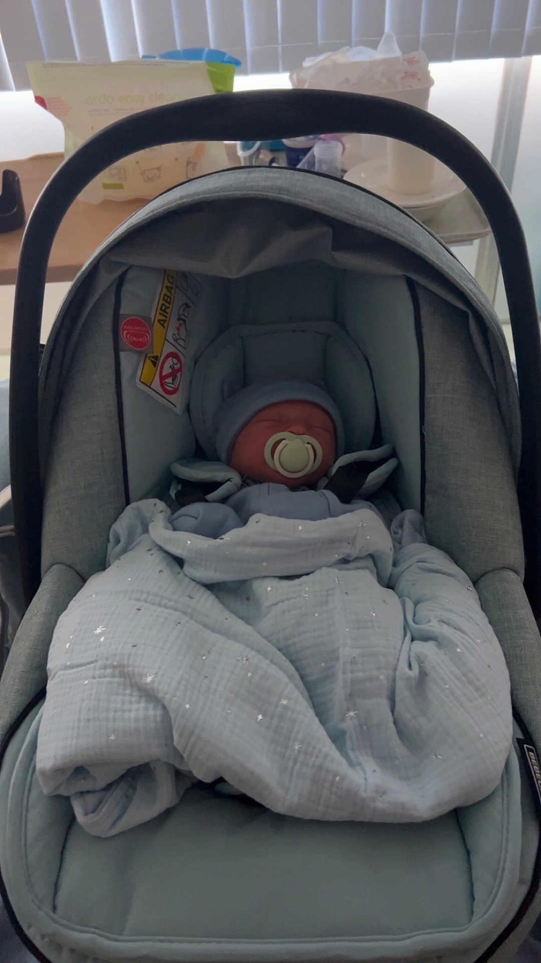 Atlas is registered to the contest to win money with this photo: baby, car_seat, blanket, pacifier, indoor, infant, sleeping, headwear, soft_toys, child, fabric, cushion, person, newborn, resting, baby_clothes, seat, comfort, nap, home