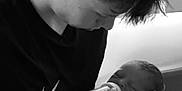 Atlas joined the competition — help win amazing prizes! baby, bottle, feeding, black_and_white, boy, child, infant, newborn, person, portrait, young_adult, holding, love, care, indoor, bed, blanket, clothing, hair, skin