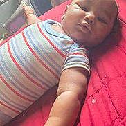 Xi'Orrhion joined the competition — help win amazing prizes! air_conditioner, arm, baby, bed, child, cute, face, furniture, hand, indoor, infant, kitkat_container, person, red_quilt, relaxing, resting, skin, sleepwear, striped_clothing, young_child