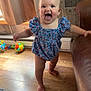 Scarlett joined the competition — help win amazing prizes! toddler, child, baby, romper, blue_clothing, barefoot, wooden_floor, couch, brown_leather, toys, window, curtains, indoor, smiling, happy, standing, person, home, floor_rug, playful
