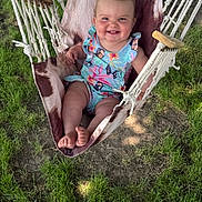 Scarlett joined the competition — help win amazing prizes! baby, child, smiling, hammock, outdoor, grass, tree, bow, clothing, happy, infant, nature, person, sitting, summer, sunlight, young, cute, playful, portrait