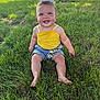 Scarlett is registered to the contest to win money with this photo: baby, child, grass, outdoor, smiling, yellow_top, denim_shorts, bow, daisy, sunlight, field, greenery, happy, sitting, nature, summer, portrait, cute, person, blue_eyes