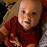 Ryan joined the competition — help win amazing prizes! baby, child, face, messy, food, mouth, red_shirt, race_car, cushion, seat, indoor, blue_eyes, expression, cute, close_up, infant, clothing, skin, portrait, sun_illustration