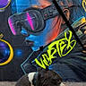 dog, street_art, graffiti, mural, urban, colorful, concrete, canine, tongue_out, sitting, black_and_white_dog, artistic, wall, portrait, vibrant, modern, fashion, headgear, outdoor, cool