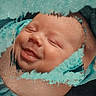 baby, smile, face, blanket, infant, portrait, closeup, soft_texture, turquoise, wrapped, sleepy, cute, newborn, child, skin, happy, cozy, warm, peaceful, artistic_effect