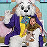 baby, child, person, costume, bunny, rabbit, glasses, purple_jacket, yellow_shirt, colorful_scarf, flowers, bench, indoor, holiday, spring, celebration, cute, smiling, decor, pose