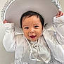 toddler, child, smiling, sombrero, hat, white_clothing, embroidery, traditional_outfit, portrait, happy, cute, baby, hands, face, indoors, celebration, festive, costume, young_child, fashion