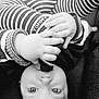 Rael participe au concours pour gagner de l'argent avec cette photo : baby, infant, hands, face, striped_clothing, sock, closeup, black_and_white, cute, child, portrait, eyes, fingers, clothing, lying_down, soft_light, monochrome, baby_garment, playful, toddler