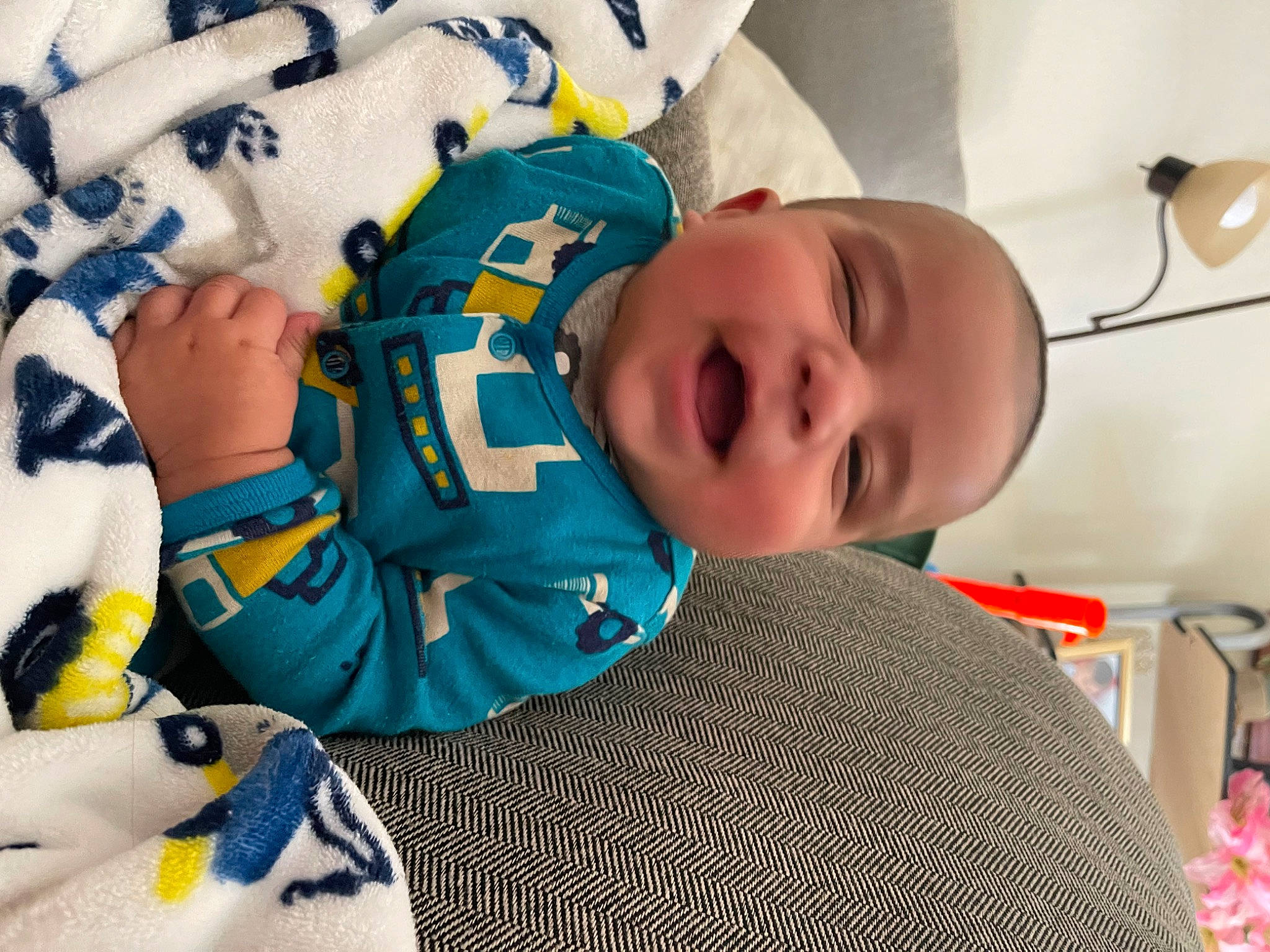 Emilio is registered to the contest to win money with this photo: baby, baby_products, baby_safety, baby_sleeping, baby_toddler_clothing, baby_toys, bedtime, cheek, child, comfort, fun, happy, human_body, linens, mouth, pattern, person, room, skin, smile