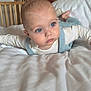 Valentin a rejoint le concours — aidez-le/la à gagner de superbes lots ! baby, infant, child, blue_eyes, tummy_time, bed, blanket, crib, bedroom, pajamas, suspenders, portrait, cute, cheeks, drool, lamp, pillow, skin, gaze, close_up