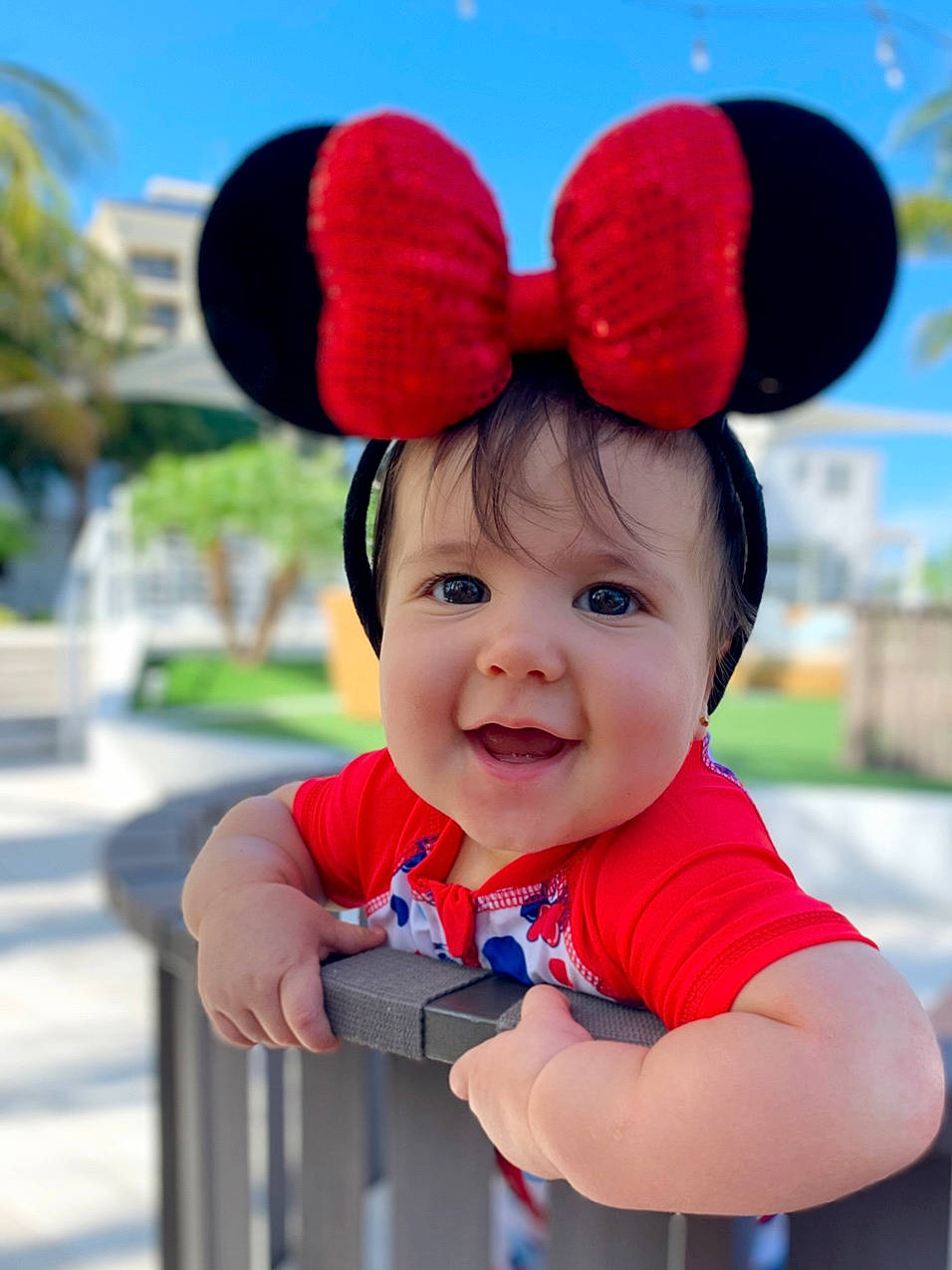 Anshali is registered to the contest to win money with this photo: baby, child, ear, happy, headgear, organ, person, plant, red, smile, toddler, vacation