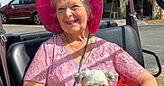 Ellie Rose is registered to the contest to win money with this photo: american_flag, blue_sky, bracelet, clouds, cute, dog_clothing, elderly_woman, handbag, happy, lace, outdoor, pet, pink_dress, pink_hat, portrait, small_dog, smiling, sunny_day, vehicle_seat, watch