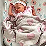Florence joined the competition — help win amazing prizes! baby, newborn, sleeping, blanket, pink, headband, crib, floral, heart_pattern, infant, cute, cozy, peaceful, clothing, child, face, bed, soft, resting, indoors