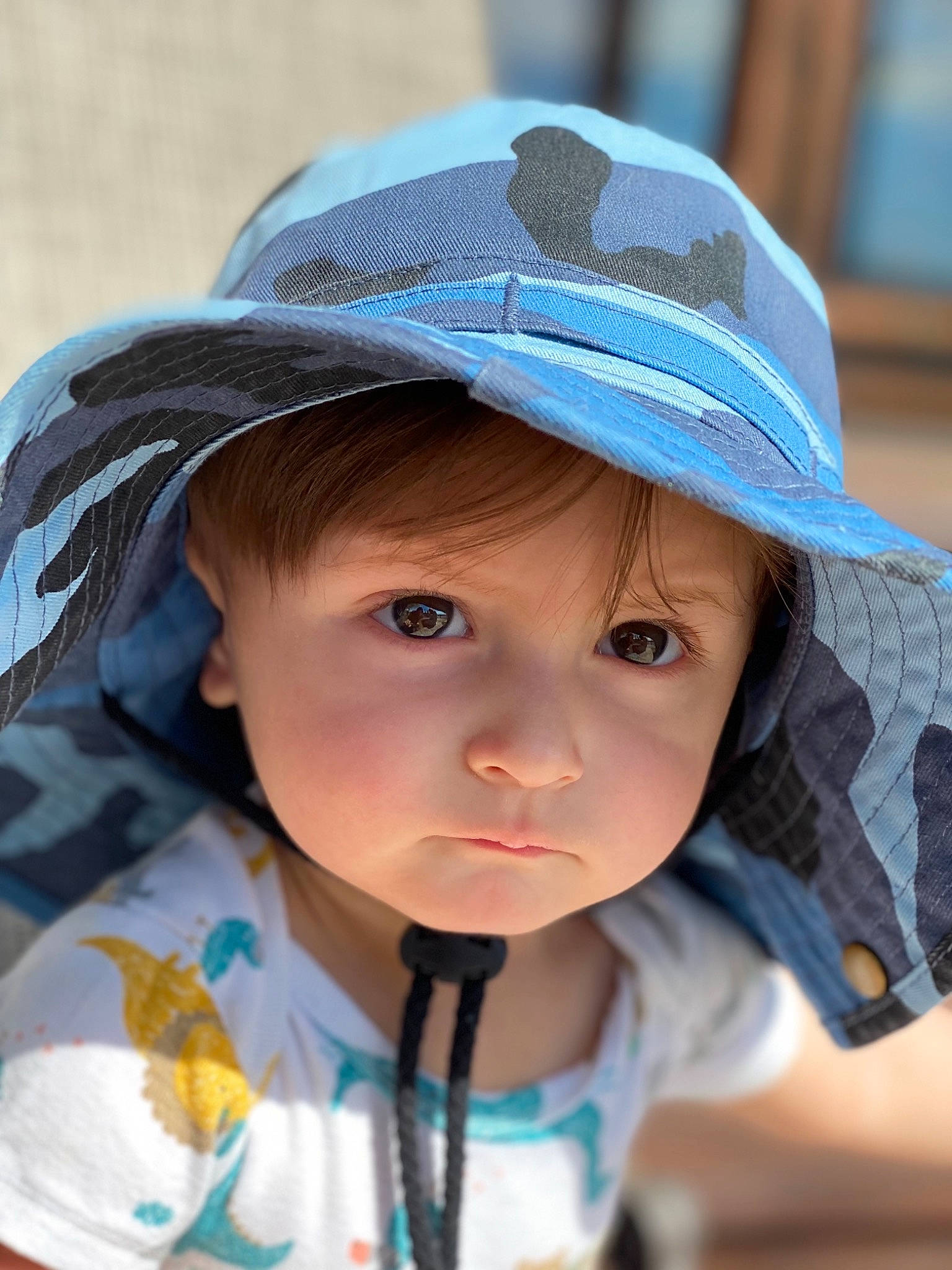 Charlie is registered to the contest to win money with this photo: azure, cap, cheek, chin, eye, face, facial_expression, hairstyle, hat, head, headwear, human, lip, nose, organ, outerwear, person, product, skin, smile