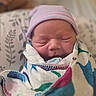 Remington is registered to the contest to win money with this photo: baby, blanket, child, closeup, colorful, cozy, cute, fabric, face, hat, indoors, infant, newborn, peaceful, portrait, resting, sleep, sleeping, soft, wrapped