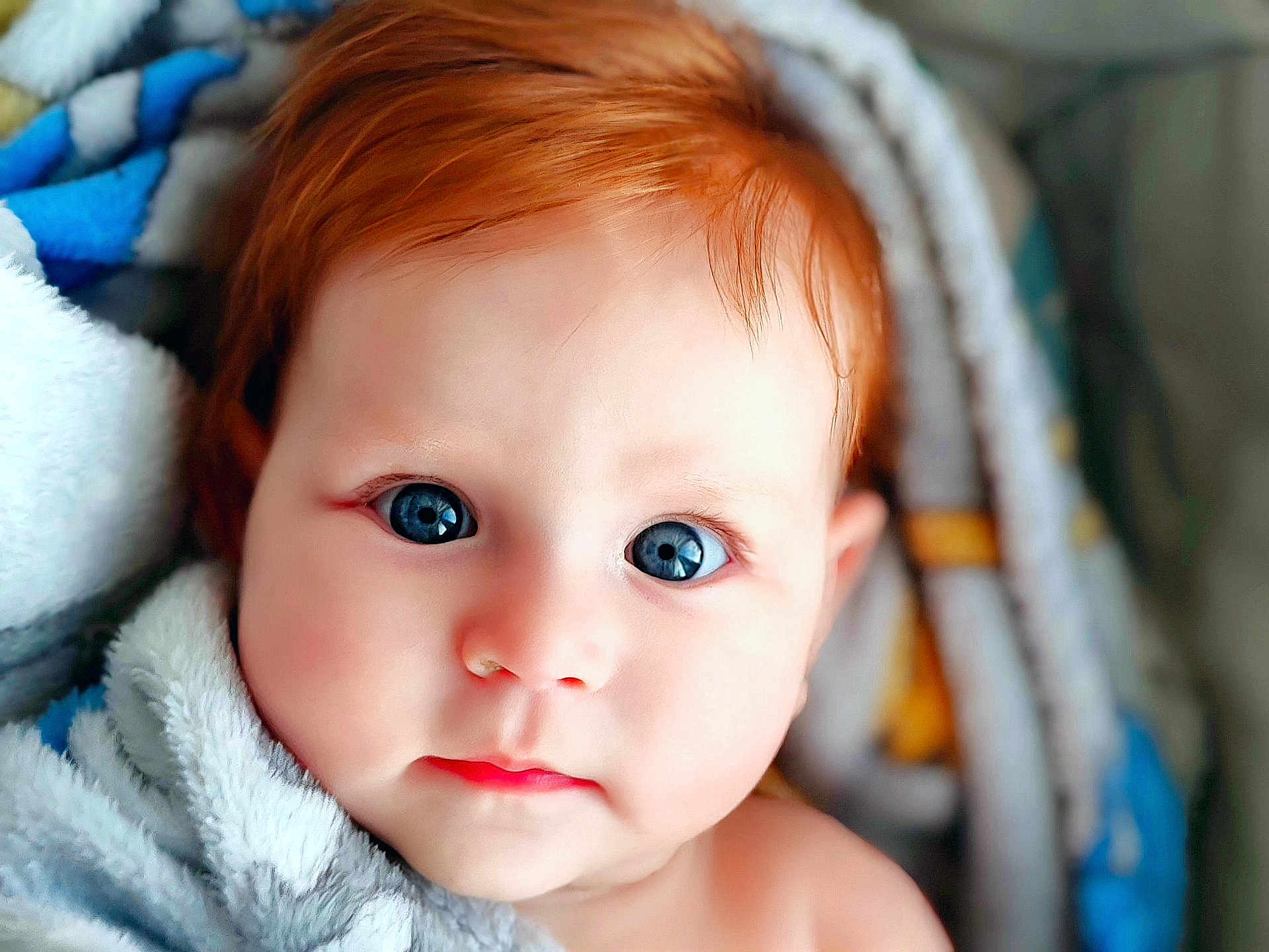 Bailey joined the competition — help win amazing prizes! baby, child, face, blue_eyes, red_hair, blanket, close_up, portrait, cute, infant, soft_texture, cozy, skin, expression, young, warm, wrapped, indoors, head, looking