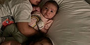 Joseph is registered to the contest to win money with this photo: child, baby, sleeping, bed, blanket, pillow, indoor, family, siblings, cute, toddler, infant, cozy, resting, clothing, portrait, closeup, love, comfort, home