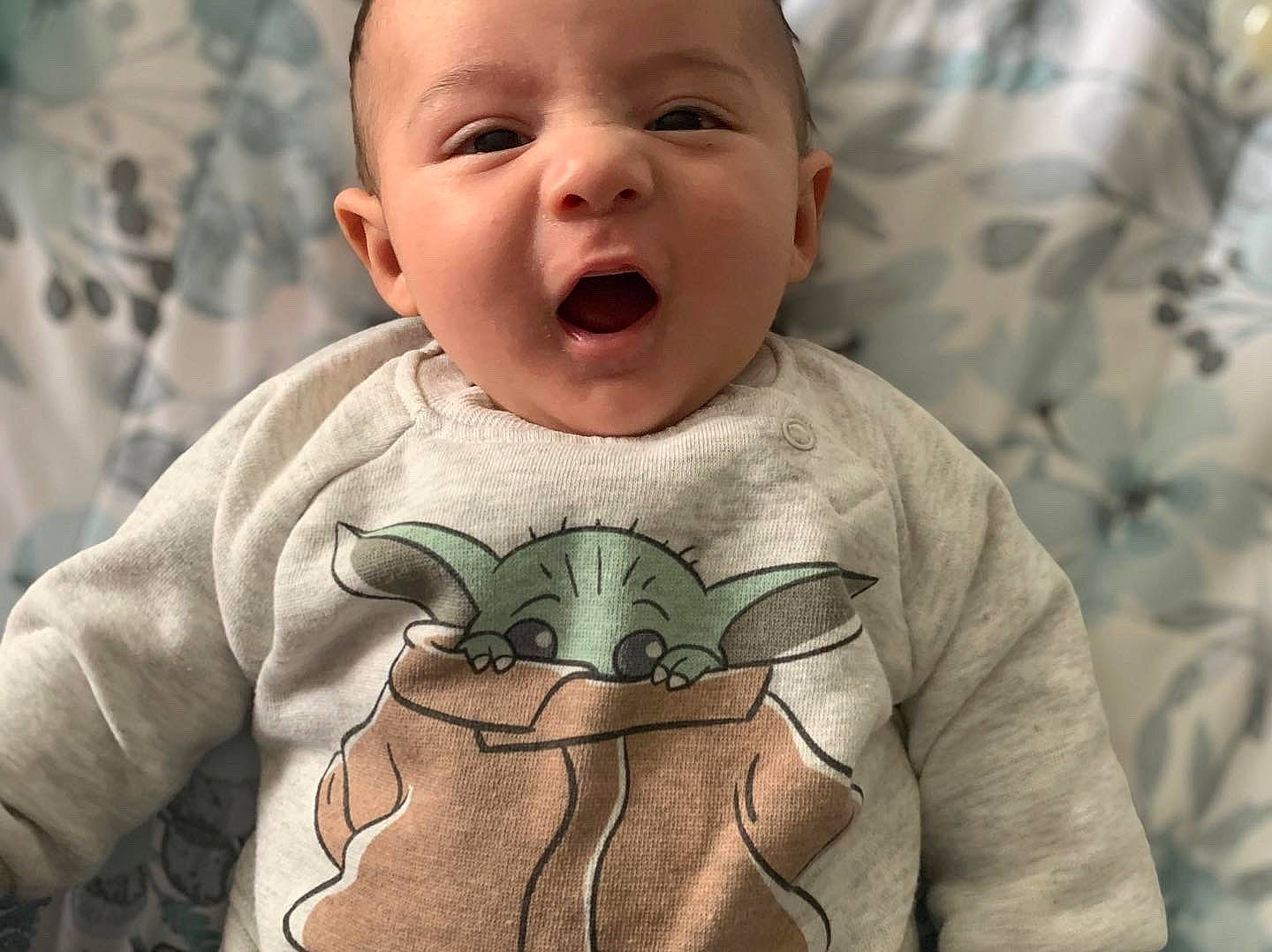 Chico is registered to the contest to win money with this photo: baby, baby_toddler_clothing, cheek, eye, facial_expression, forehead, gesture, happy, head, human, mammal, mouth, neck, nose, organ, person, photograph, product, skin, sleeve