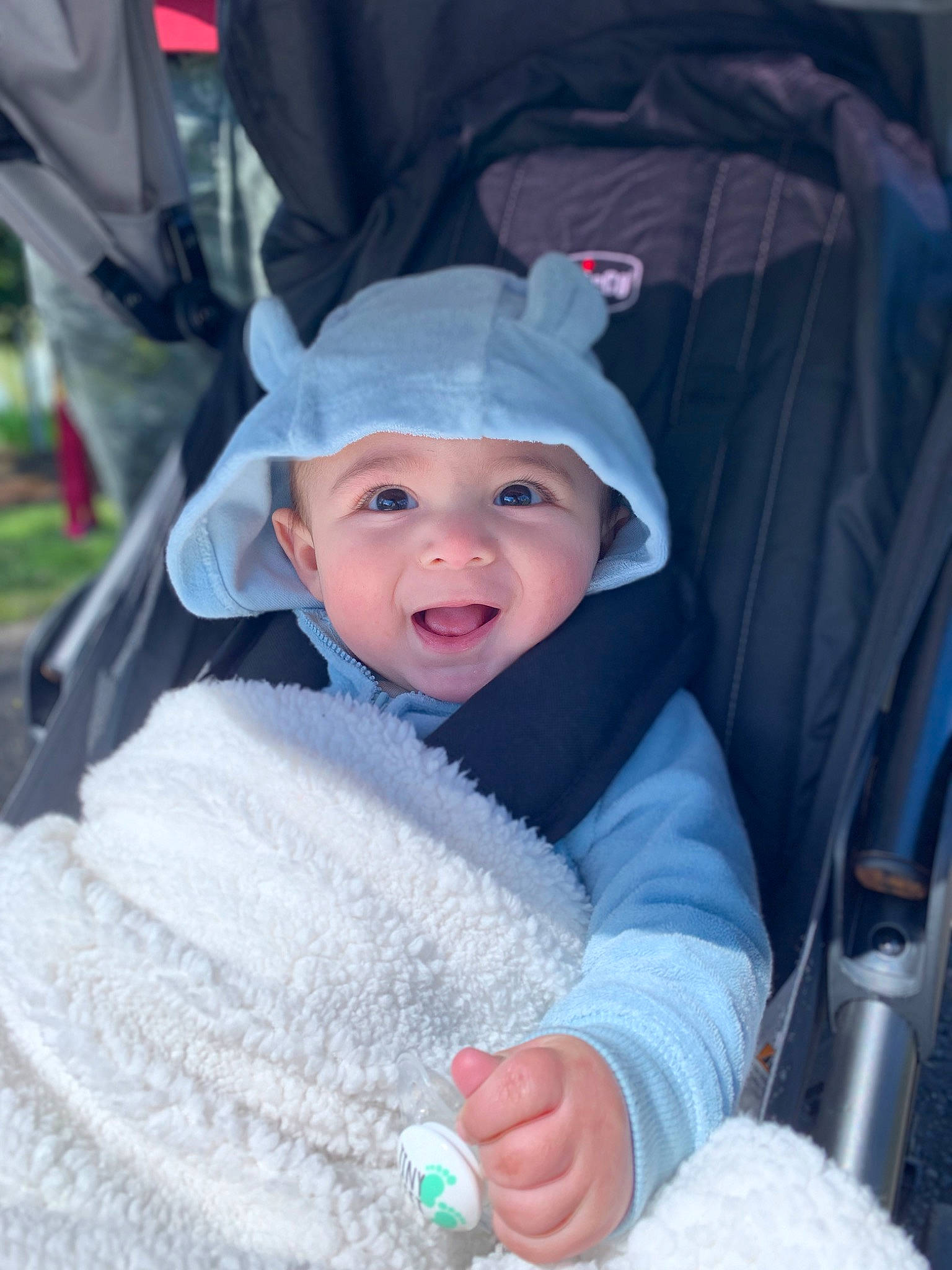 Chico joined the competition — help win amazing prizes! baby, baby_carriage, baby_products, cap, car_seat, child, costume, electric_blue, event, eye, eyebrow, fashion_accessory, fun, happy, headwear, mouth, person, plant, product, smile