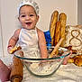 Rafael a rejoint le concours — aidez-le/la à gagner de superbes lots ! baby, infant, toddler, chef_hat, apron, baking, dough, flour, mixing_bowl, rolling_pin, wooden_spoon, baguette, croissant, bread, kitchen, smile, messy, sitting, happy, homemade