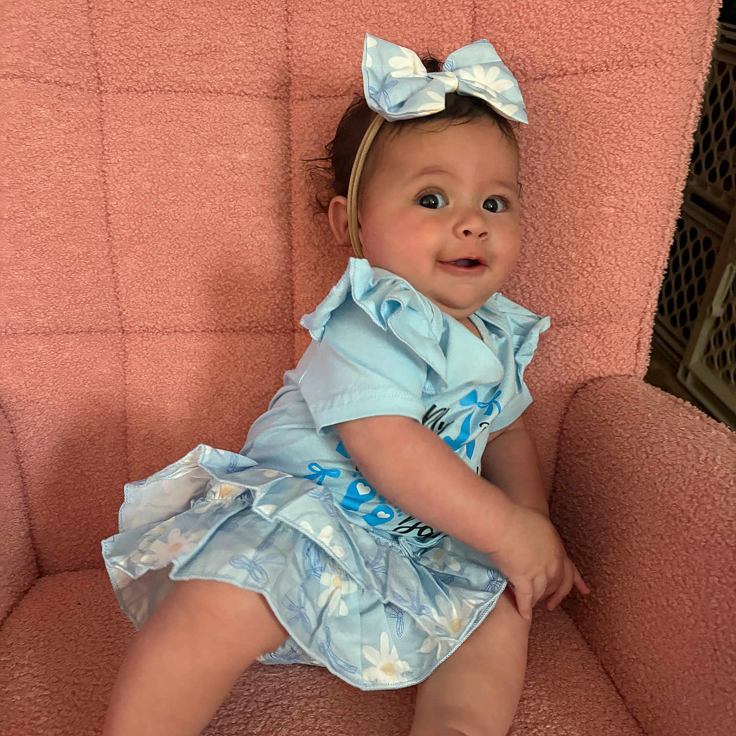 Ilyanna Naomi joined the competition — help win amazing prizes! baby, child, blue_dress, bow, smile, sitting, armchair, pink, cute, happy, indoors, person, infant, fashion, headband, portrait, plush, skin, expression, young