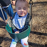 Zachary joined the competition — help win amazing prizes! toddler, child, swing, playground, outdoor, sunlight, baby, person, clothing, bib, woodchips, legs, hand, metal, toy, fun, daylight, casual, cute, park