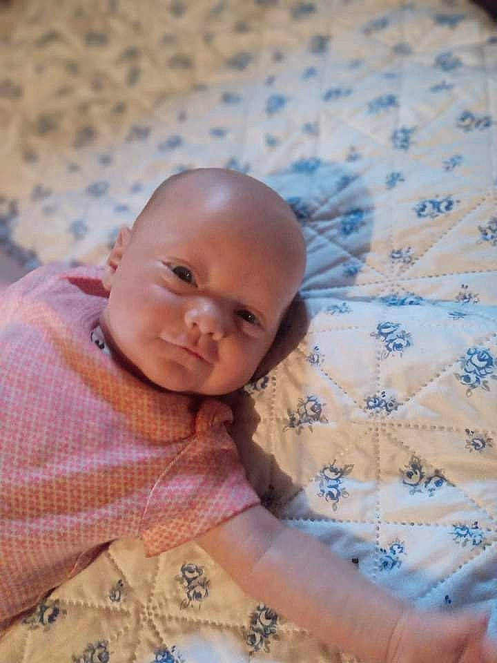 Hazzel joined the competition — help win amazing prizes! baby, baby_toddler_clothing, bedding, cheek, child, comfort, happy, iris, linens, nose, pattern, person, portrait_photography, room, sitting, skin, sleeve, textile, toddler, wood