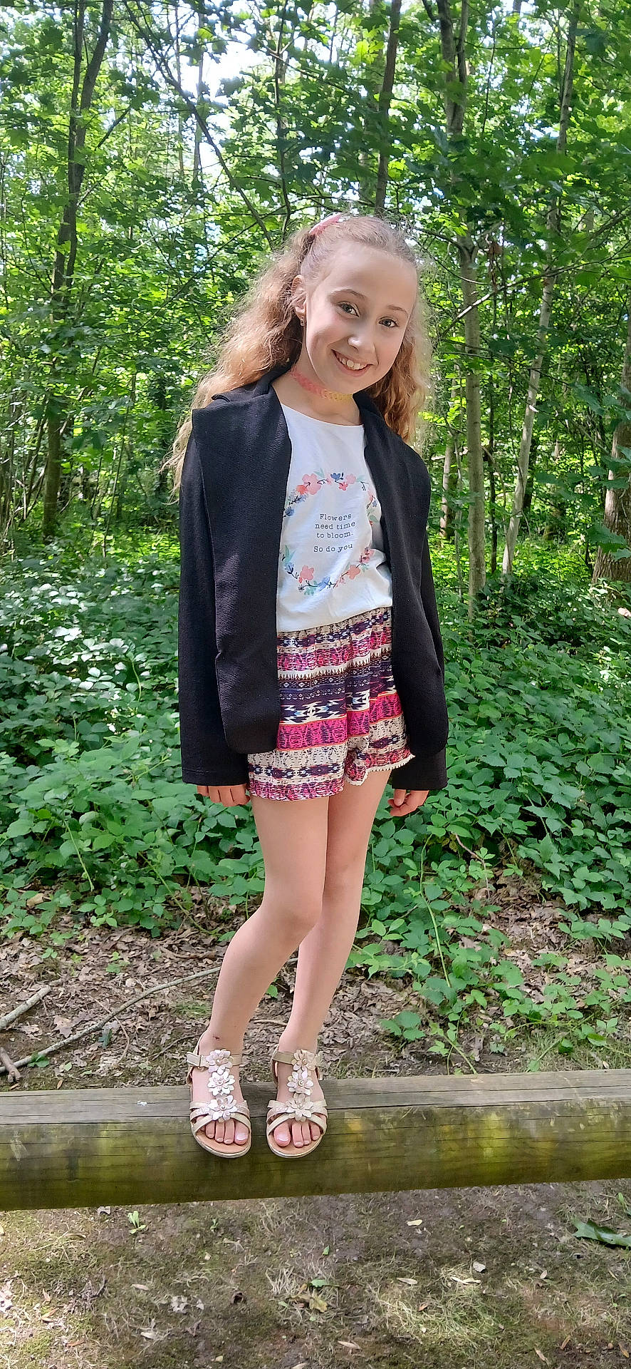 Enola participe au concours pour gagner de l'argent avec cette photo : blazer, clothing, coat, dress, face, grove, head, jacket, land, nature, outdoors, person, photography, plant, portrait, rainforest, skirt, tree, vegetation, woodland