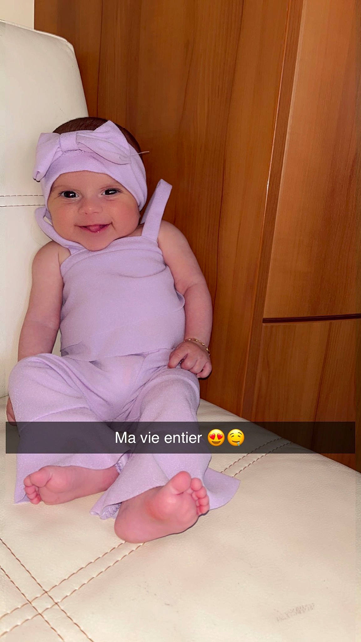 Tennessy participe au concours pour gagner de l'argent avec cette photo : arm, baby, baby_toddler_clothing, cheek, comfort, finger, foot, fun, happy, headwear, human_body, joy, knee, magenta, person, pink, purple, sleeve, smile, thigh