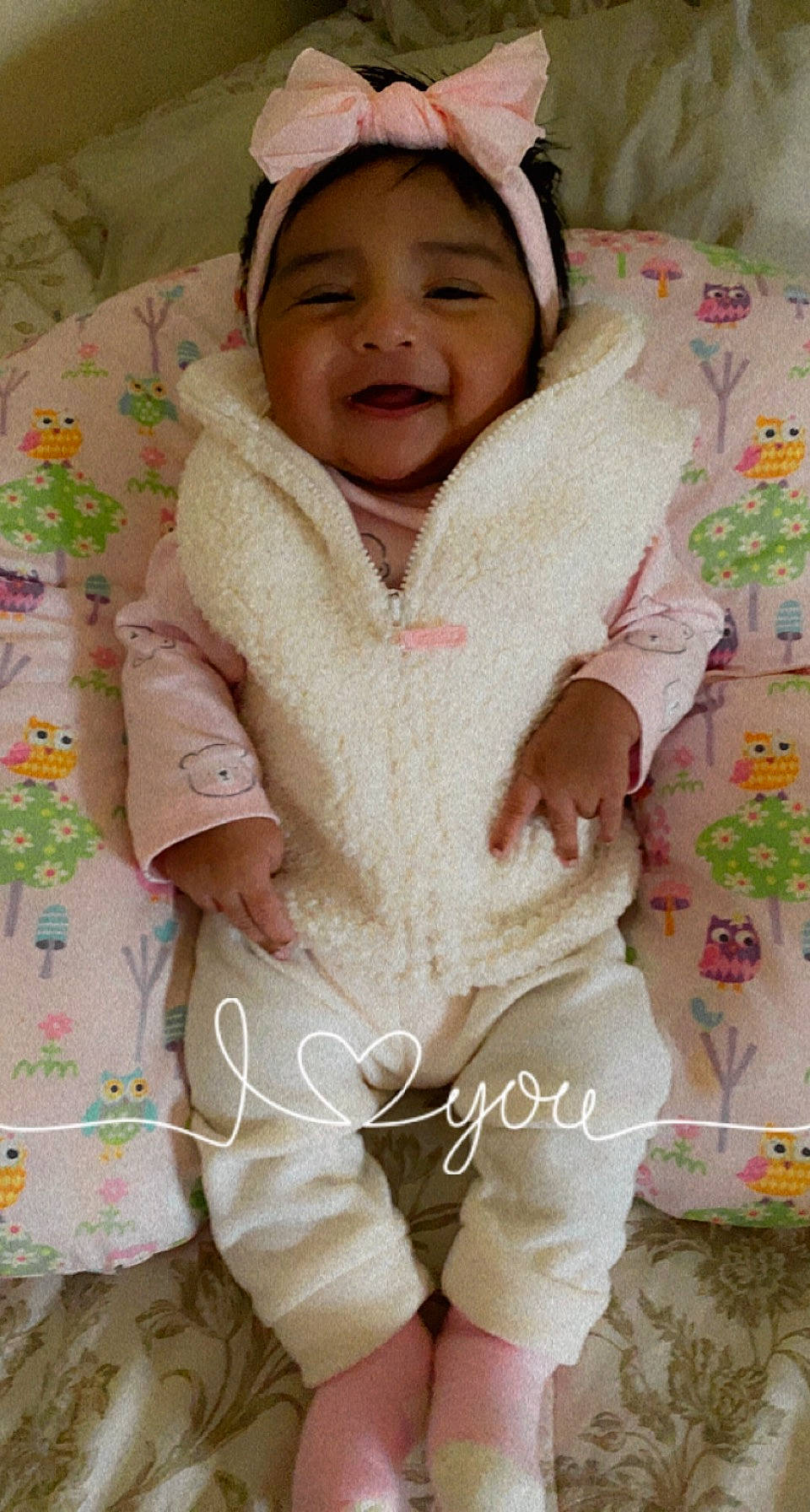 Madelynn joined the competition — help win amazing prizes! baby, baby_toddler_clothing, cheek, child, collar, comfort, face, finger, happy, hat, linens, outerwear, pattern, person, pink, skin, sleeve, smile, textile, toddler