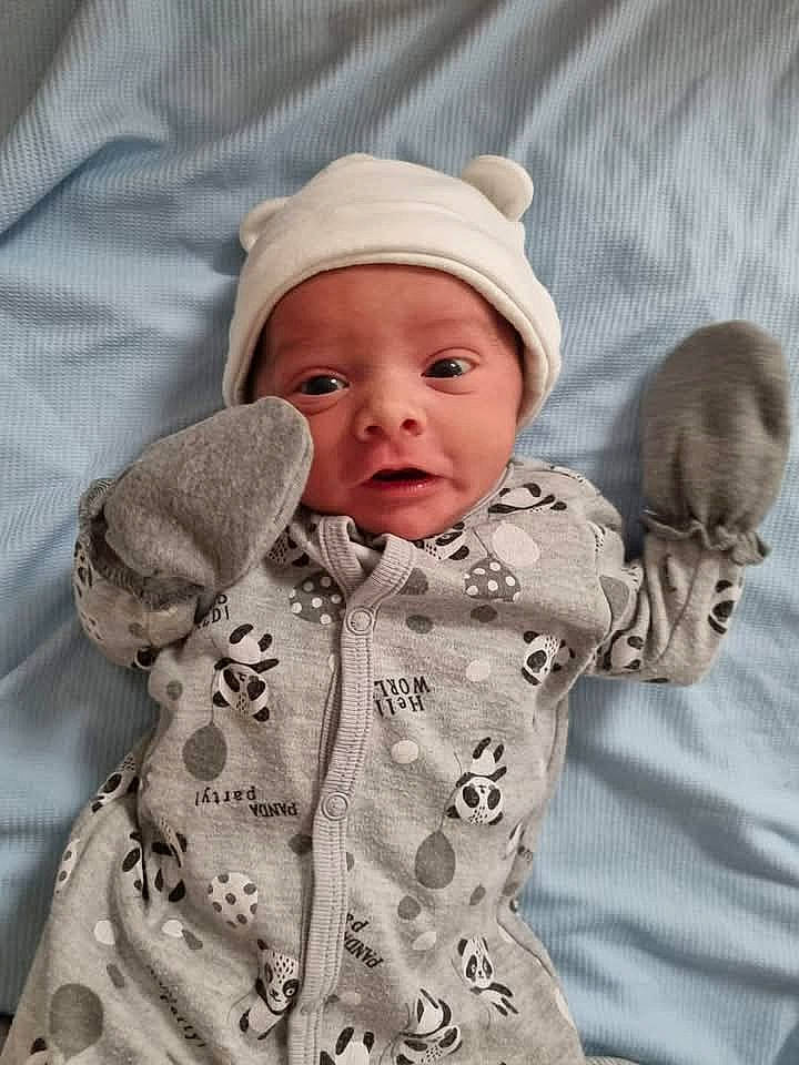 Rylee is registered to the contest to win money with this photo: baby, face, happy, head, person, photography, portrait, sad, yawning