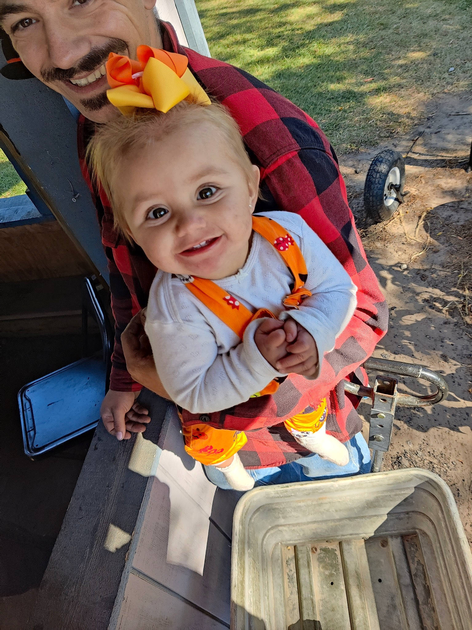 Melody is registered to the contest to win money with this photo: baby, baby_carriage, baby_products, child, eye, face, facial_expression, fun, happy, leisure, motor_vehicle, orange, people, person, plant, recreation, sitting, smile, summer, toddler