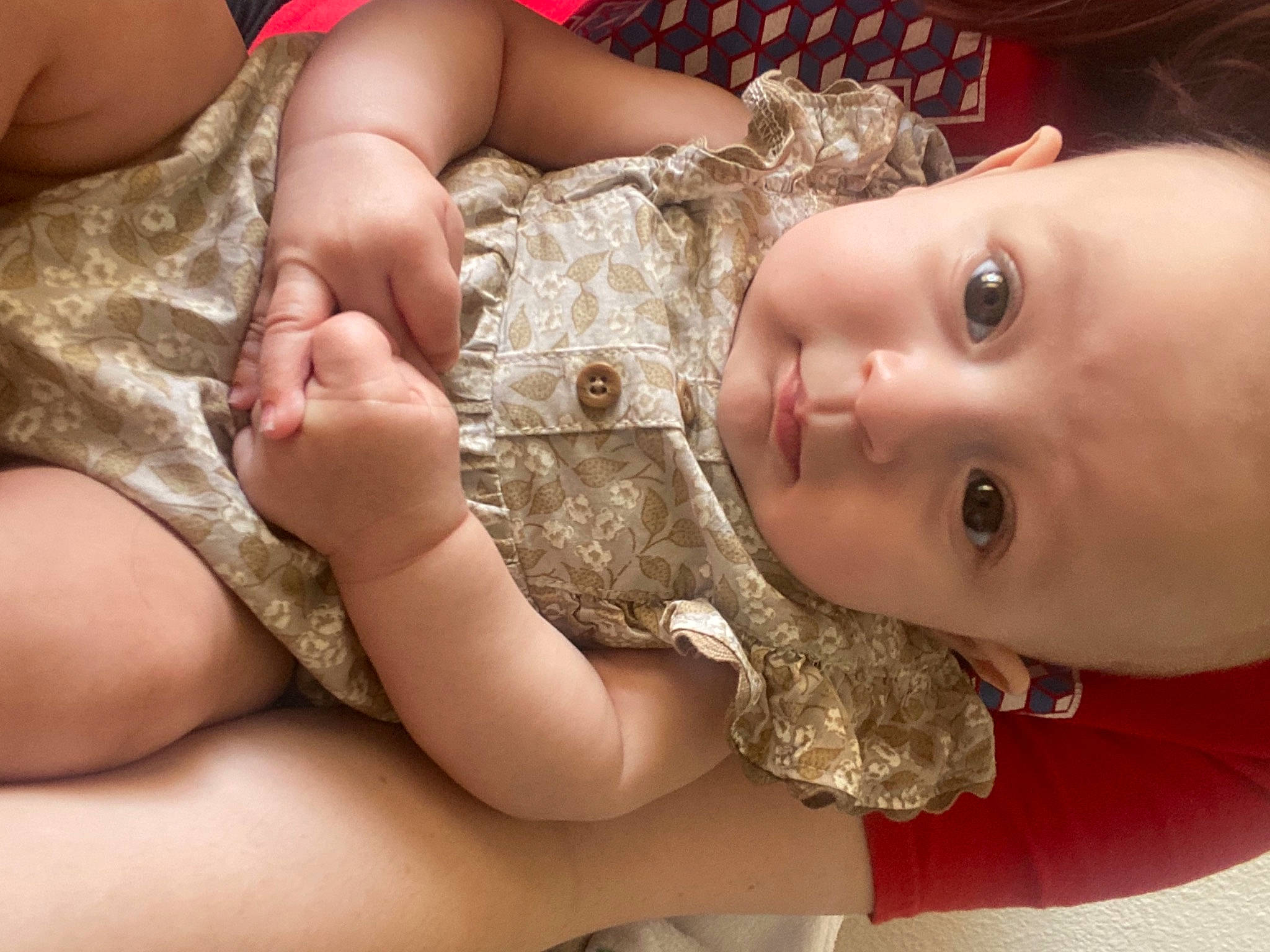 Kamilla is registered to the contest to win money with this photo: baby, baby_toddler_clothing, cheek, dress, eyelash, finger, gesture, hand, happy, human_body, iris, lip, mouth, muscle, nail, neck, nose, person, skin, smile