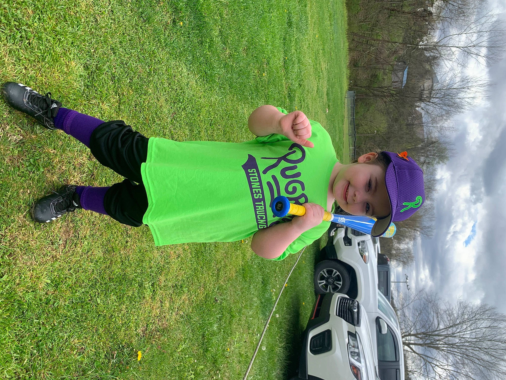 Mckinley joined the competition — help win amazing prizes! automotive_exterior, car, fun, grass, headwear, joy, knee, leisure, people_in_nature, person, plant, recreation, shorts, smile, sportswear, t_shirt, tire, toddler, tree, vehicle