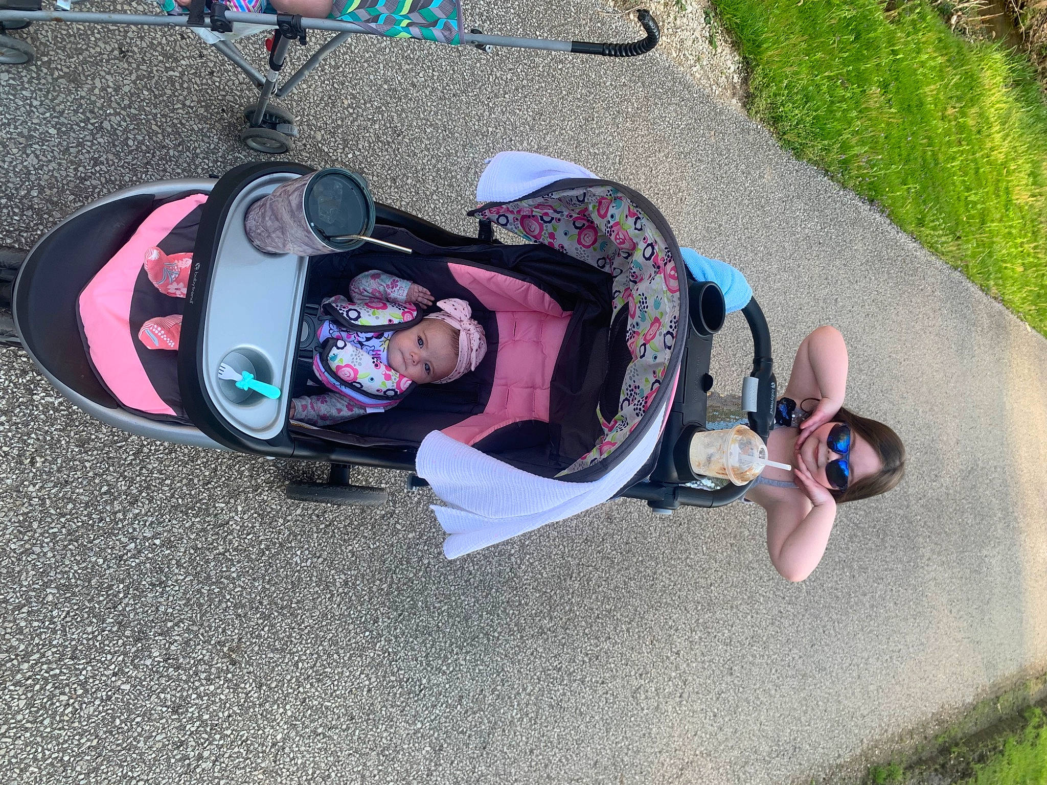 Mckinley is registered to the contest to win money with this photo: asphalt, auto_part, automotive_wheel_system, baby, carmine, fun, grass, headwear, helmet, leisure, motor_vehicle, person, personal_protective_equipment, recreation, shoe, smile, sneakers, sports_gear, tire, toddler