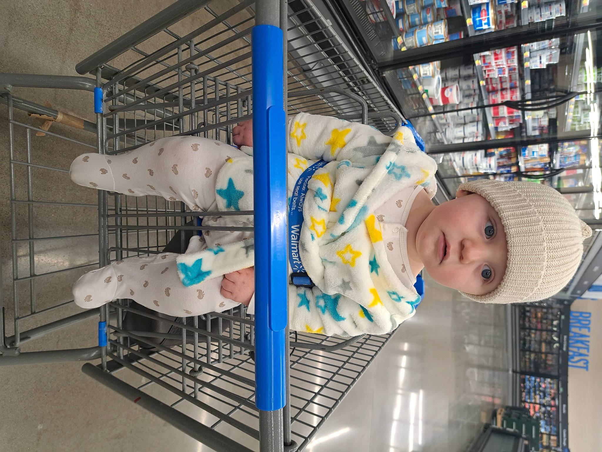 Liam joined the competition — help win amazing prizes! baby, baby_safety, baby_toddler_clothing, child, customer, engineering, headwear, machine, person, retail, room, science, service, shelf, smile, supermarket, toddler