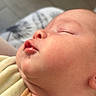 Noelio participe au concours pour gagner de l'argent avec cette photo : baby, sleeping, closeup, face, skin, infant, peaceful, portrait, cozy, yellow_clothing, newborn, soft_light, child, cute, indoors, resting, young, head, human, calm