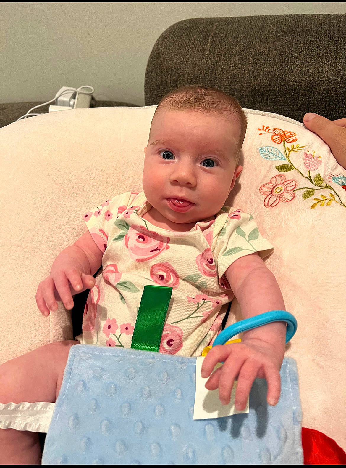 Lexie is registered to the contest to win money with this photo: baby, baby_products, baby_toddler_clothing, carmine, cheek, child, comfort, fun, happy, linens, pattern, person, pink, play, room, sitting, skin, sleeve, textile, toddler