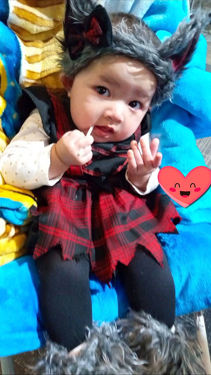 Andrea joined the competition — help win amazing prizes! baby, baby_toddler_clothing, child, costume_hat, fashion_accessory, fictional_character, fun, fur, happy, headpiece, headwear, pattern, people, person, pink, plaid, recreation, sitting, textile, toddler