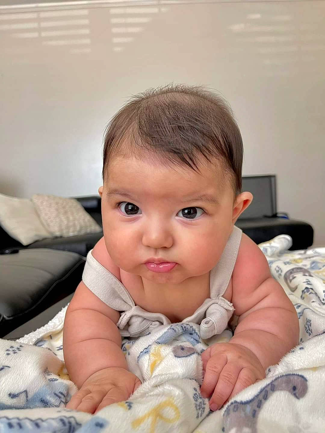 Sterling is registered to the contest to win money with this photo: baby, baby_toddler_clothing, cheek, child, comfort, drinkware, ear, eyelash, flooring, happy, iris, linens, lip, nose, person, room, sitting, skin, sleeve, toddler