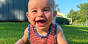 Rhys joined the competition — help win amazing prizes! baby, child, smiling, grass, outdoor, sunlight, blue_sky, tank_top, happy, portrait, greenery, summer, yard, building, person, cute, infant, nature, daylight, face