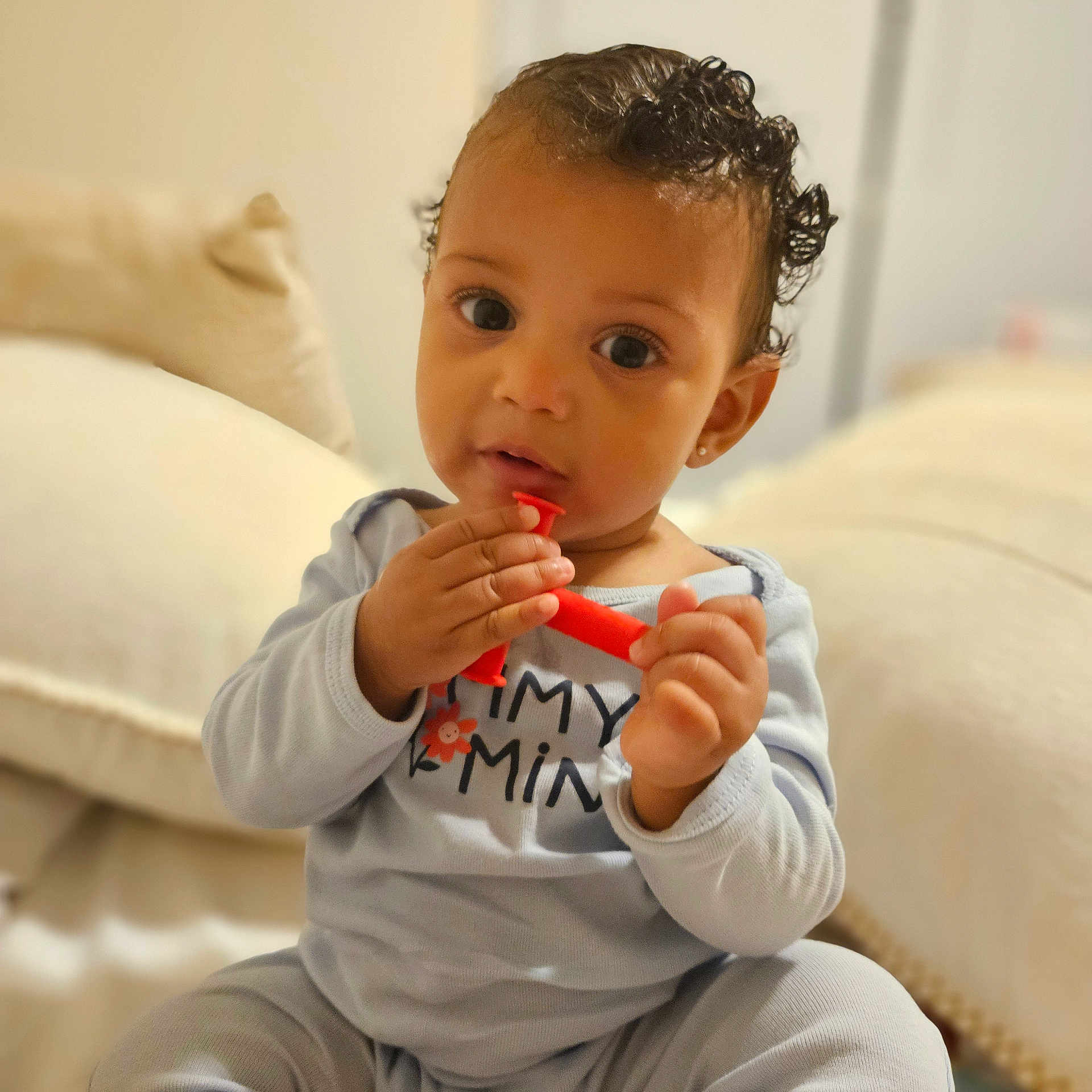 Savannah joined the competition — help win amazing prizes! baby, biting, bodypart, cosmetics, couch, eating, face, finger, food, furniture, hand, head, lipstick, person, photography, portrait, sitting