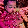 toddler, child, baby, curly_hair, pink_outfit, hearts_pattern, sitting, blanket, indoor, portrait, cute, big_eyes, curious, cozy, soft_lighting, purple_light, young_child, person, clothing, couch