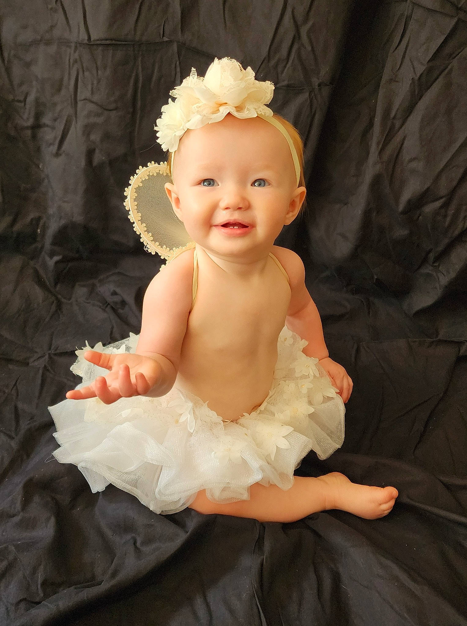 Everleigh joined the competition — help win amazing prizes! arm, baby, baby_toddler_clothing, bridal_accessory, child, costume, dress, embellishment, fashion_accessory, flash_photography, happy, headband, headpiece, iris, jewellery, joy, peach, person, petal, sleeve