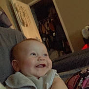 Westin joined the competition — help win amazing prizes! baby, smiling, indoor, child, face, clothing, door, closet, furniture, person, happy, arm, couch, room, head, human, infant, home, blur, grainy