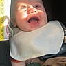 Westin is registered to the contest to win money with this photo: baby, smiling, sunlight, car_seat, bib, clothing, blanket, happy, infant, face, child, cute, seatbelt, indoors, portrait, closeup, warm_light, joyful, soft, cozy